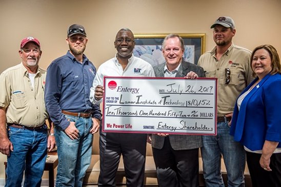 On hand at the check presentation was (l to r) Ricky Riggs, utility foreman; Cade Sherwin, lineman; Dr. Lonnie Howard, LIT president; Vernon Pierce, vice president of customer service; Logan Chilek, lineman; and Pam Williams, customer service manager.